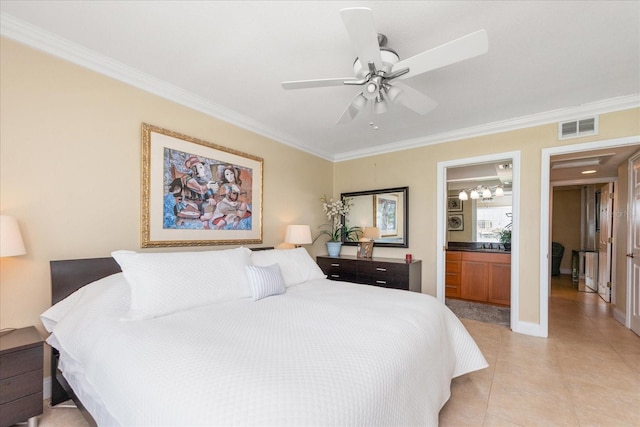 bedroom with light tile patterned floors, crown molding, ensuite bath, and ceiling fan