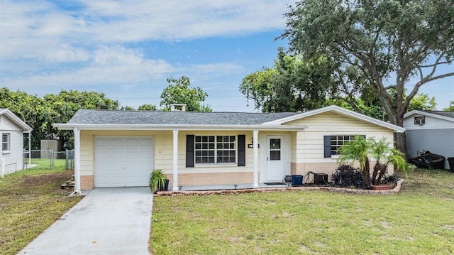 ranch-style house featuring a garage and a front yard