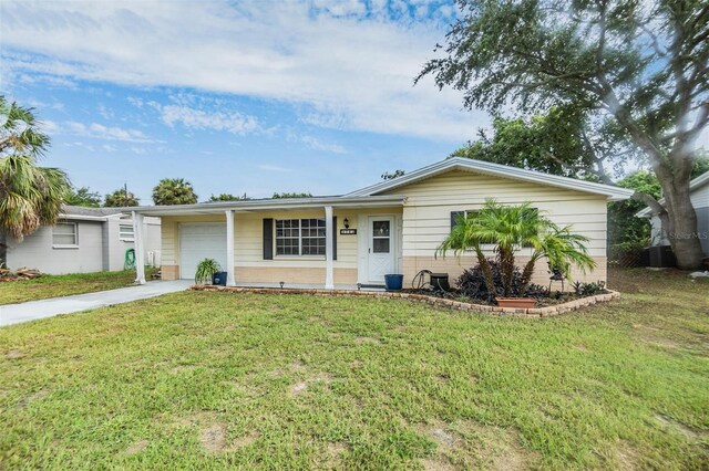 single story home with a garage and a front yard