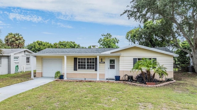 single story home featuring a garage and a front yard