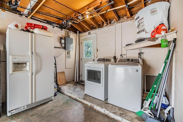 clothes washing area with electric panel and washer and dryer