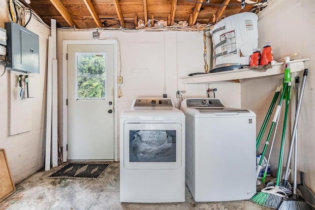 washroom with electric panel and independent washer and dryer