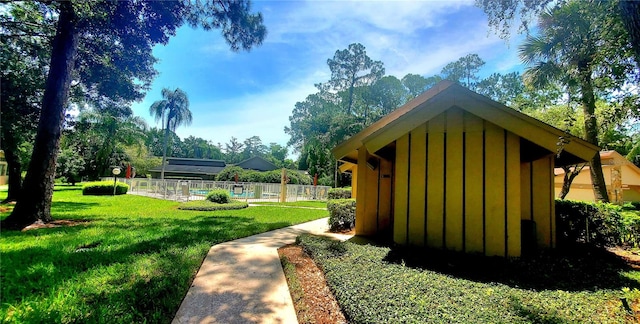 exterior space with a yard and a swimming pool