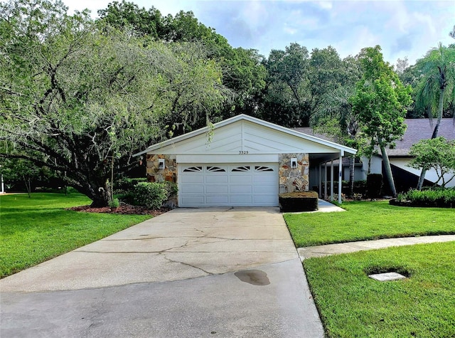 view of front of home featuring a garage and a front lawn