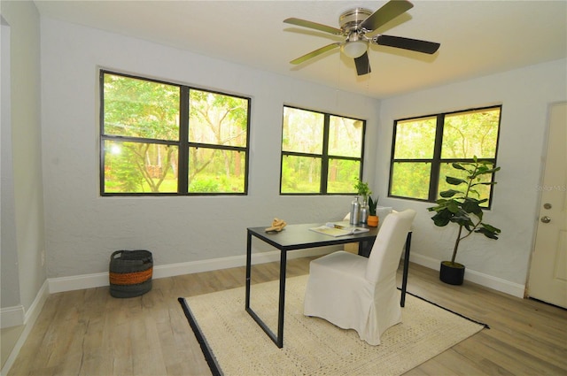 home office featuring light wood-style flooring and baseboards