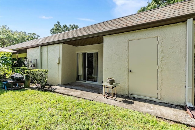 back of house with a lawn