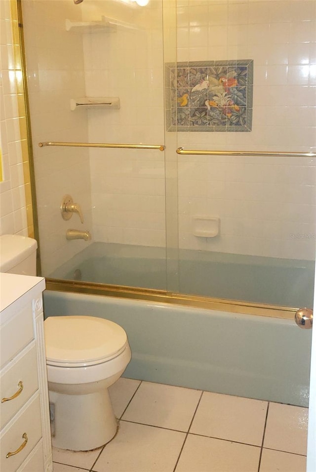 full bathroom with tile patterned flooring, vanity, and bath / shower combo with glass door