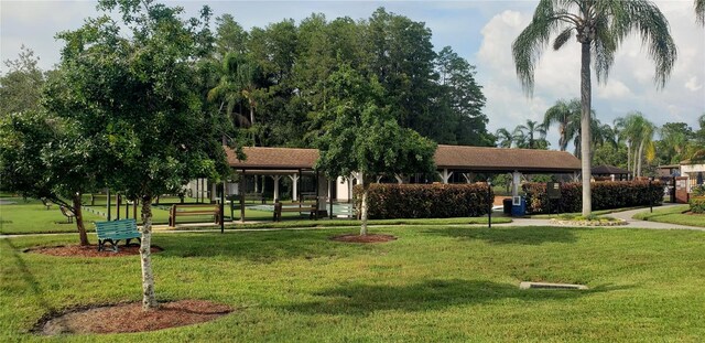 view of home's community featuring a lawn