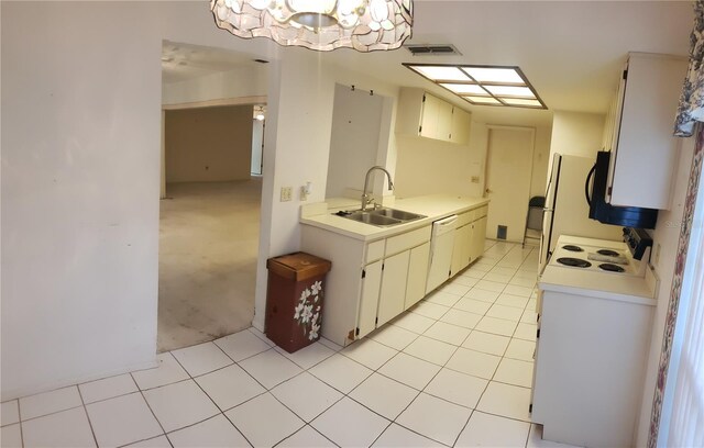 kitchen with a chandelier, sink, light carpet, dishwasher, and stove