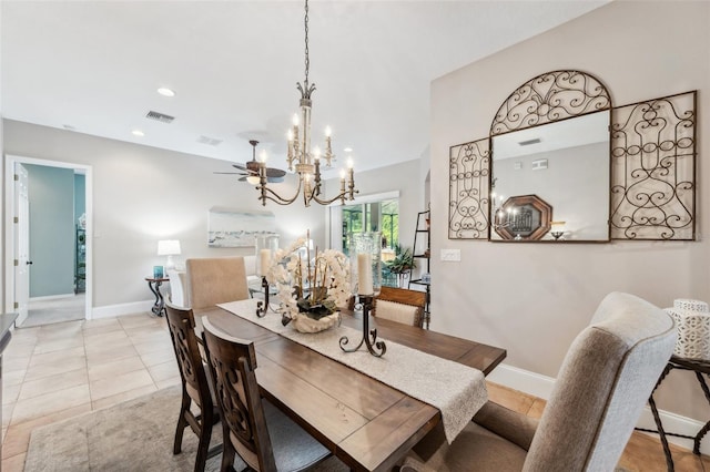 tiled dining area with an inviting chandelier