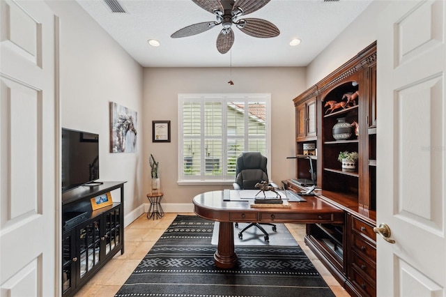 home office featuring ceiling fan and light tile patterned floors