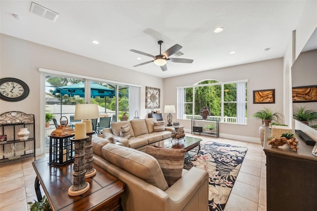 tiled living room featuring ceiling fan