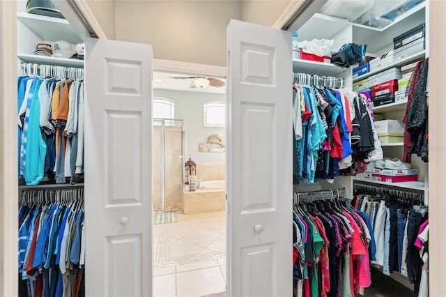 spacious closet featuring light tile patterned floors