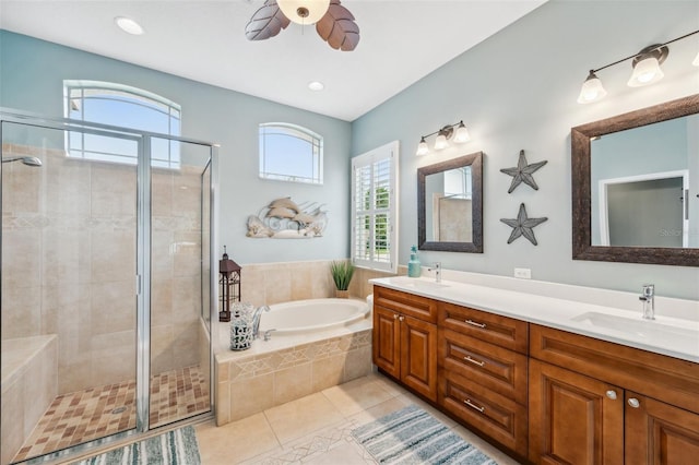 bathroom featuring ceiling fan, vanity, separate shower and tub, and tile patterned flooring