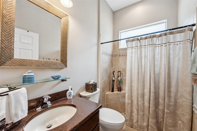 bathroom featuring vanity, toilet, and a shower with shower curtain