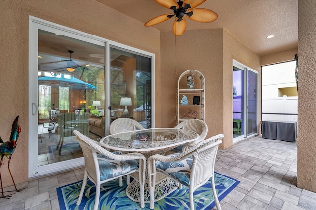 view of patio / terrace featuring ceiling fan