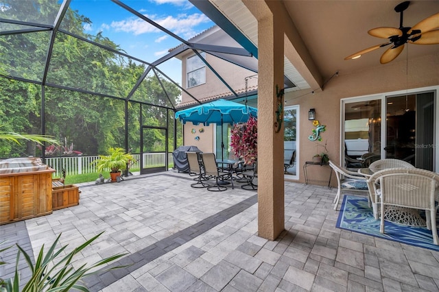 view of patio with ceiling fan and a lanai