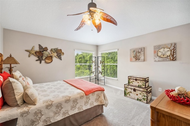 bedroom with ceiling fan and carpet