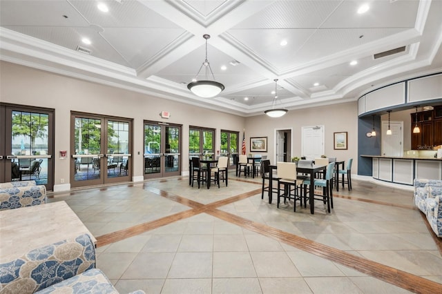 tiled dining area with coffered ceiling, a towering ceiling, ornamental molding, and french doors