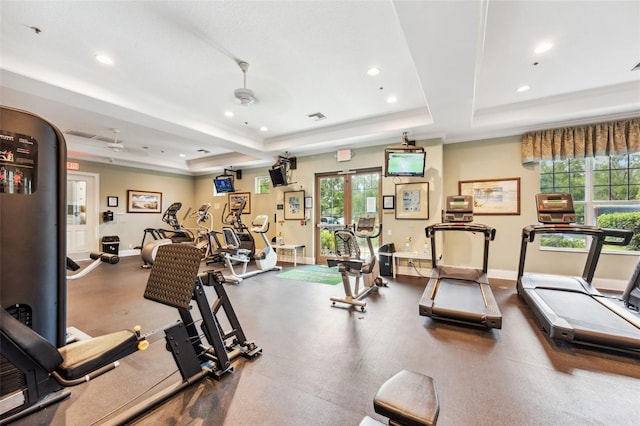 gym with a tray ceiling