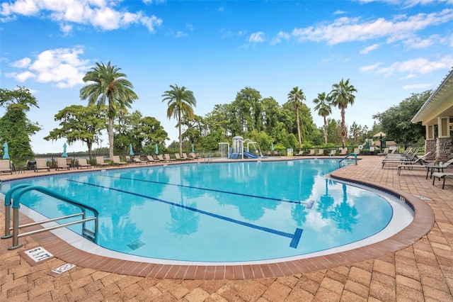 view of swimming pool featuring a patio area