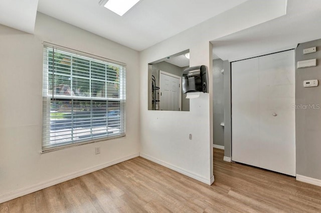 unfurnished room featuring light hardwood / wood-style floors