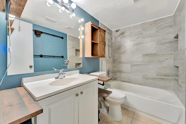 full bathroom with vanity, toilet, tiled shower / bath combo, and tile patterned flooring