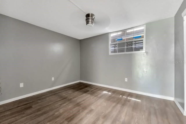 unfurnished room with hardwood / wood-style floors