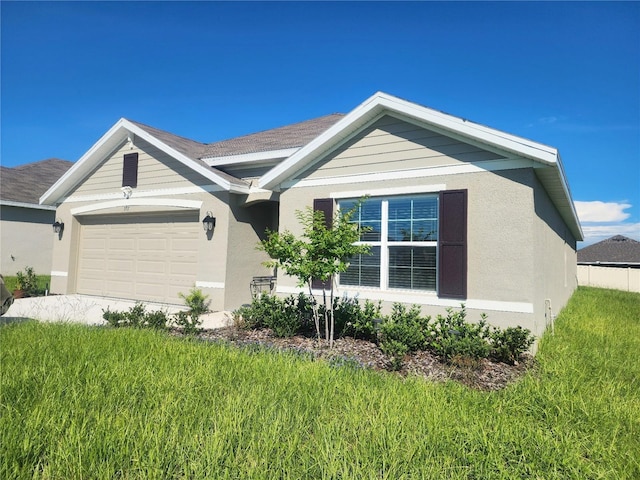 view of front facade with an attached garage and stucco siding