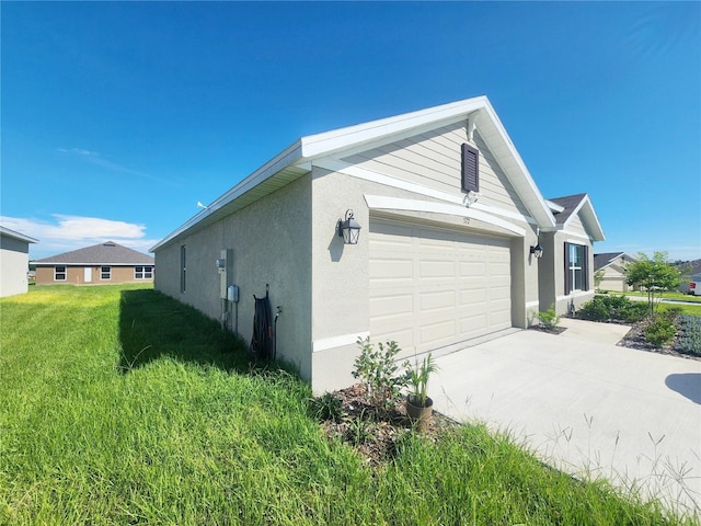 view of home's exterior with concrete driveway, a yard, an attached garage, and stucco siding