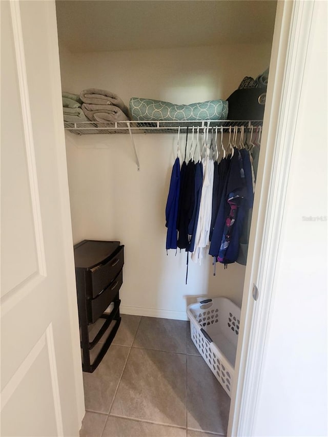 spacious closet featuring tile patterned floors