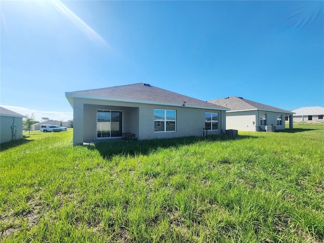 rear view of property with stucco siding