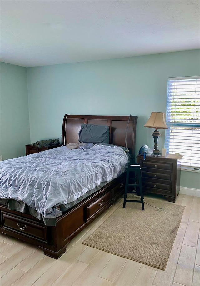 bedroom with wood finished floors