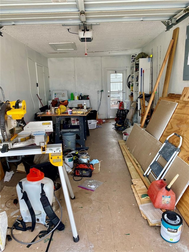 garage featuring a garage door opener and electric panel