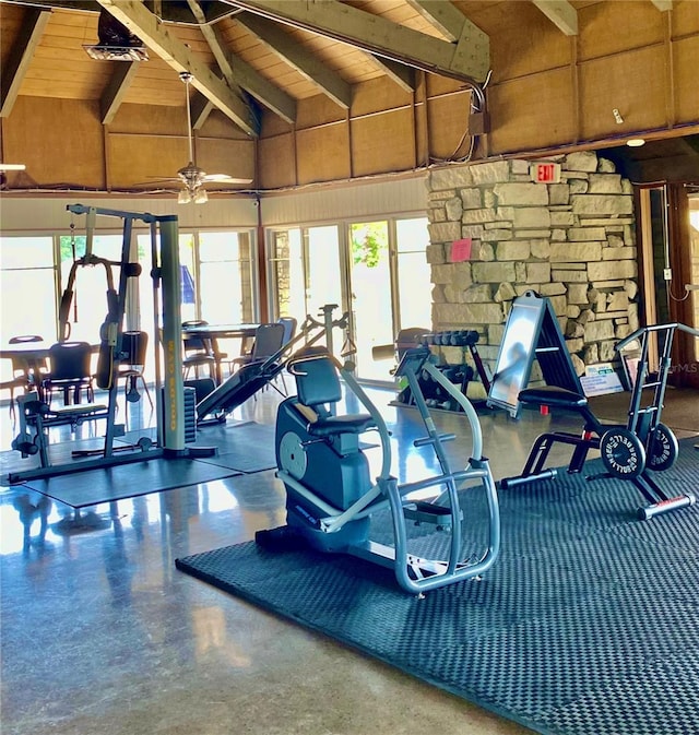 gym with high vaulted ceiling and wood ceiling