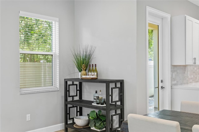 room details with baseboards and decorative backsplash