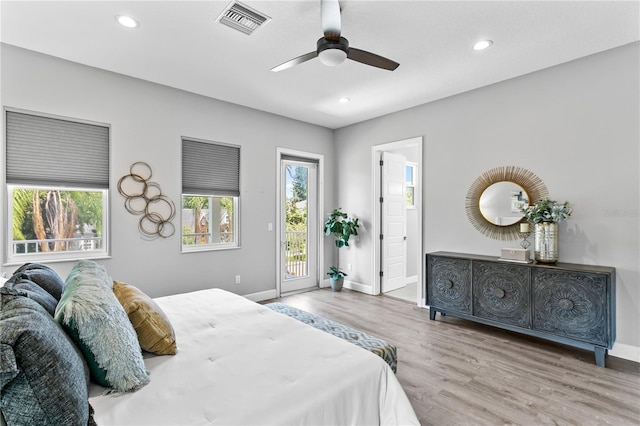 bedroom featuring baseboards, visible vents, wood finished floors, access to exterior, and recessed lighting