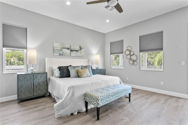 bedroom featuring recessed lighting, wood finished floors, visible vents, and baseboards