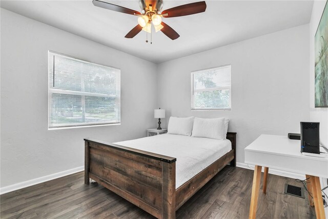 bedroom featuring dark hardwood / wood-style flooring and ceiling fan