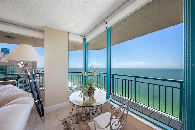 balcony featuring a water view