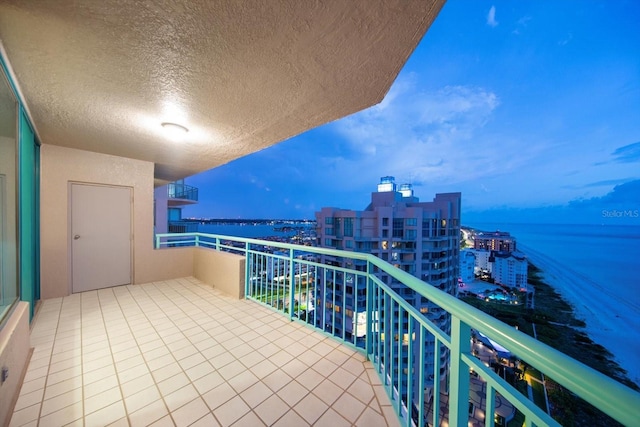 balcony featuring a water view