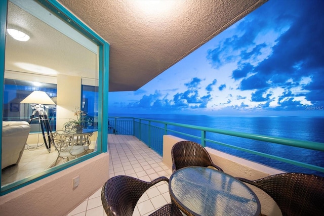 balcony featuring a water view