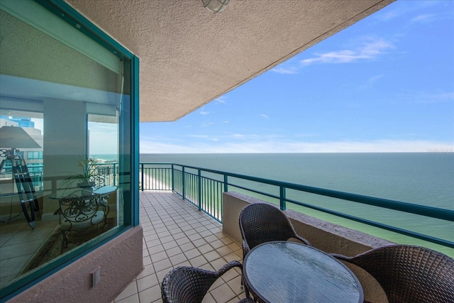 balcony featuring a water view