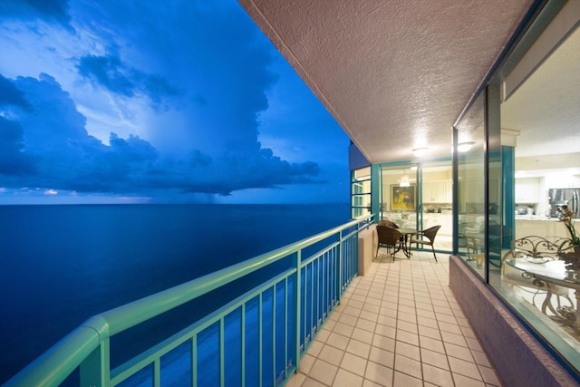 balcony at dusk with a water view