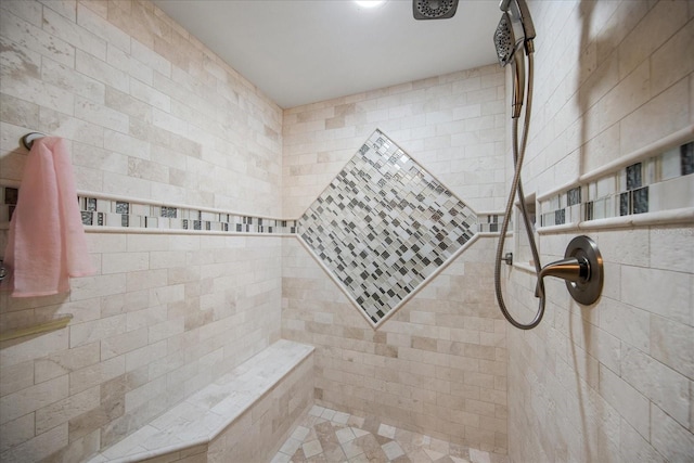 bathroom featuring a tile shower