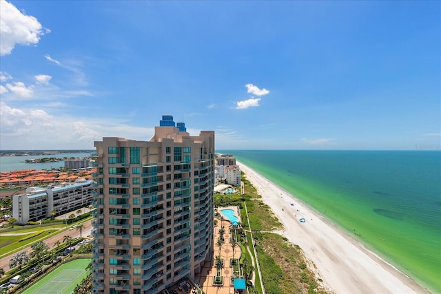drone / aerial view of a nearby body of water and apartment complex