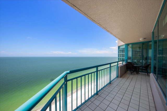balcony featuring a water view