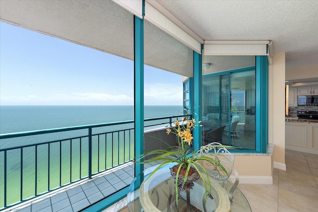 balcony featuring a water view