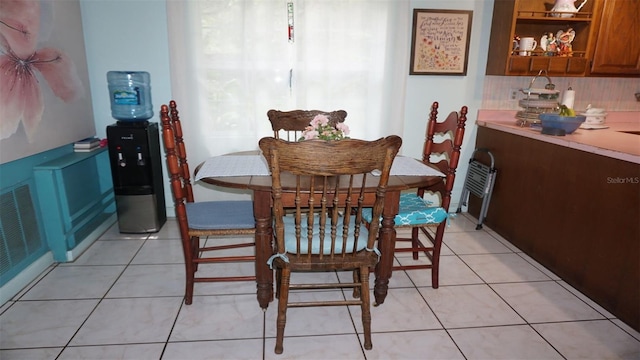 dining area with light tile patterned flooring