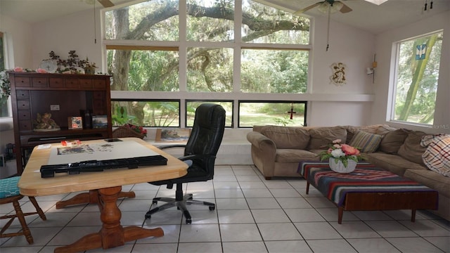 tiled office featuring ceiling fan, vaulted ceiling, and plenty of natural light